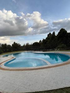 a large swimming pool in the middle of a park at Apartment in Kitusuri in Nairobi