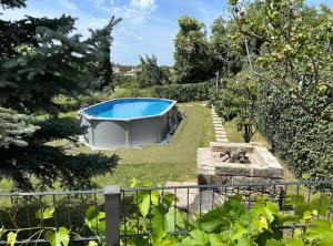 a garden with a swimming pool in the yard at Istrian Private Garden Oasis in Žminj