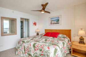 a bedroom with a bed and a ceiling fan at Mana Kai Maui Condo - Right on the Beach! in Wailea +29 photos