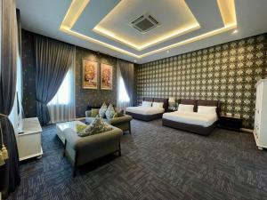 a living room with two couches and a couch at Casa Bianca in Kluang +54 photos