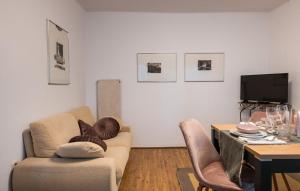 a living room with a couch and a table at Villa Maria in Krnica