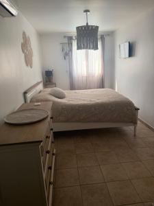 a bedroom with a bed and a window at Maison individuelle piscine extérieure in Port-Saint-Louis-du-Rhône +19 photos
