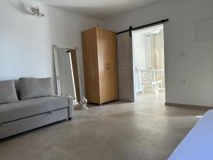 a living room with a couch and a sliding door at Apartment daal Seline in Seline