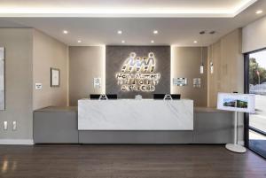 a lobby of a dental office with a reception desk at Magic Moment Resort & Kids Club, Dazzler Select by Wyndham in Kissimmee