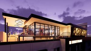 a large building with lights on top of it at Hyatt Place Guyana Georgetown in Georgetown