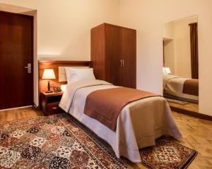 Voodi või voodid majutusasutuse Arève Résidence Boutique Hotel toas