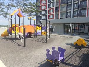 a playground in front of a building at Sufi Idaman Homestay for Islamic only in Nilai