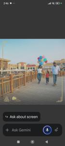 a picture of people walking on a pier with umbrellas at Madinaty Summer cottage in Cairo