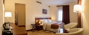 Voodi või voodid majutusasutuse Arève Résidence Boutique Hotel toas