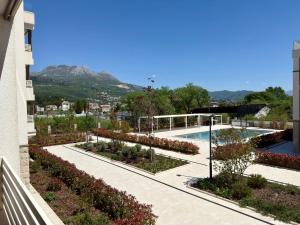 a view of a garden from a building at Lira Bay in Igalo