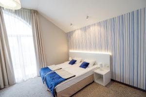 Posteľ alebo postele v izbe v ubytovaní Hotel Aleksandria