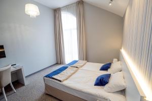 Posteľ alebo postele v izbe v ubytovaní Hotel Aleksandria
