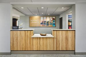a lobby with a counter in a store at Hampton Inn & Suites Destin in Destin +45 photos