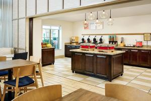 a large kitchen with a table and chairs at Hampton Inn & Suites Destin in Destin