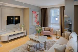 a living room with a couch and a tv at Valente Suites&Hotel in Istanbul