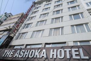 a hotel sign in front of a building at The Ashoka Hotel in Howrah