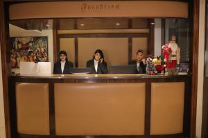 a group of women sitting at a reception desk at The Ashoka Hotel in Howrah +21 photos