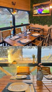 a dining room with a table and chairs and a table and chairs at Delta Land Bungalows in Crisan