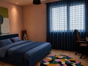 a bedroom with a bed and a desk and a window at Garden of Silance in Cîrcea