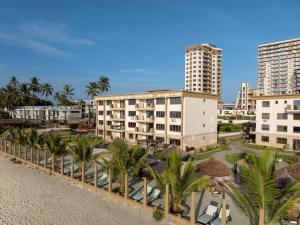 an aerial view of a resort with palm trees and buildings at Tulip Residences Vipingo Mombasa in Mombasa