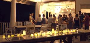 a group of people standing in a room with tables and chairs at Good Vibes Villas in Unawatuna +64 photos