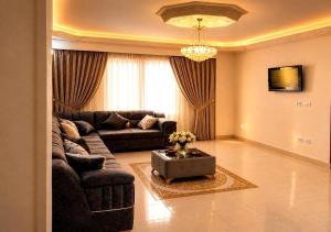 a living room with a couch and a table at ليالي اكتوبر in 6th Of October