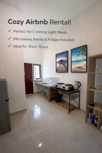 a room with a desk and a table at Lot 766, Langkawi in Pulau Langkawi