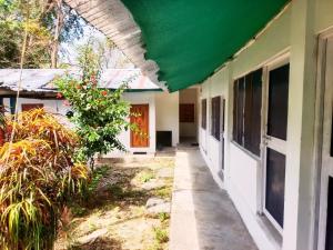 a walkway leading to the front of a house at The Blue Planet Long Island in Middle Andaman