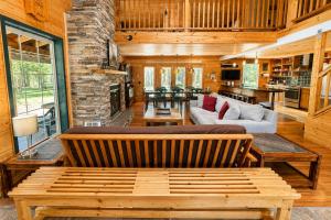 a living room with a bed and a couch at Pine Acres by NW Comfy Cabins in Leavenworth