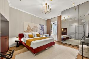 a bedroom with a large bed and a bathroom at King Richards Royal Residence in Dubrovnik