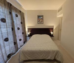a bedroom with a bed in a room at Virginia N101 ST2 in Grasse