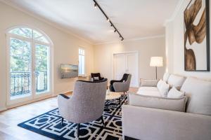 a living room with a couch and chairs at Villa Lebensart - App 7 Lebensart in Ahlbeck
