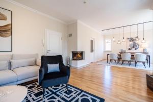 a living room with a couch and a fireplace at Villa Lebensart - App 7 Lebensart in Ahlbeck