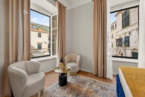 a bedroom with a bed and a window at King Richards Royal Residence in Dubrovnik