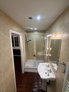 a bathroom with a sink and a shower at Lucy Cross Guest House in Lucy Cross +55 photos