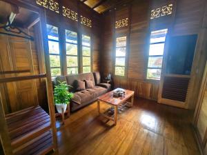 a living room with a couch and a table at 361 Alam in Tetebatu