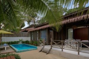 a villa with a swimming pool and a resort at One Beach Resort by EHM in Koh Rong Sanloem
