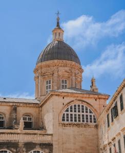 a building with a domed roof with a cross on top at King Richards Royal Residence in Dubrovnik