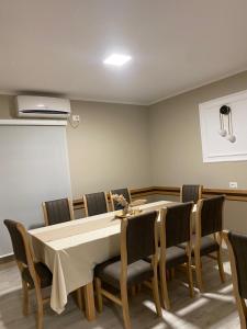 a dining room with a table and chairs at Hotel del Mar in Shëngjin