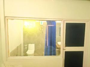 a view of a bathroom with a window and a toilet at The Blue Planet Long Island in Middle Andaman