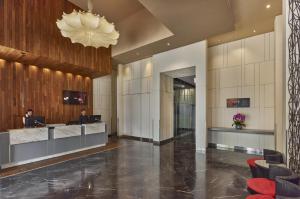a lobby of a hotel with a reception desk at Ibis Singapore Novena in Singapore