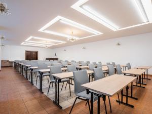 a large room with tables and chairs in it at EA Hotel Lipno in Černá v Pošumaví +66 photos