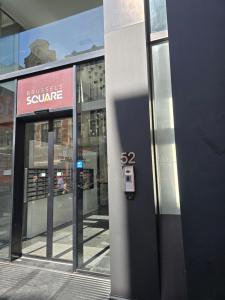 a building with a sign on the side of it at Brussels square in Brussels