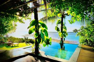 a view of the ocean from a resort with a swimming pool at Pipa Sunset Home in Pipa
