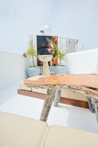 a wooden table in a room with a picture at Respirar in Peniscola +63 photos