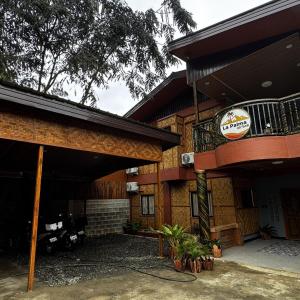 a building with a sign on the side of it at La Palma Air'bnb Malaybalay in Casisang