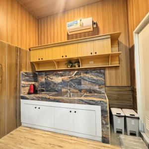 a kitchen with a sink and a counter at La Palma Air'bnb Malaybalay in Casisang