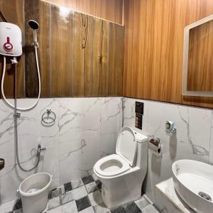 a bathroom with a toilet and a sink at La Palma Air'bnb Malaybalay in Casisang +36 photos