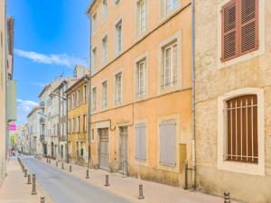 an empty street in a city with buildings at Chic Bastide in Carcassonne