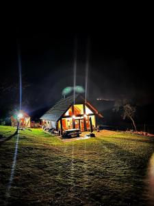 a building with a dome on top at night at Dom dwa światy in Międzybrodzie Bialskie